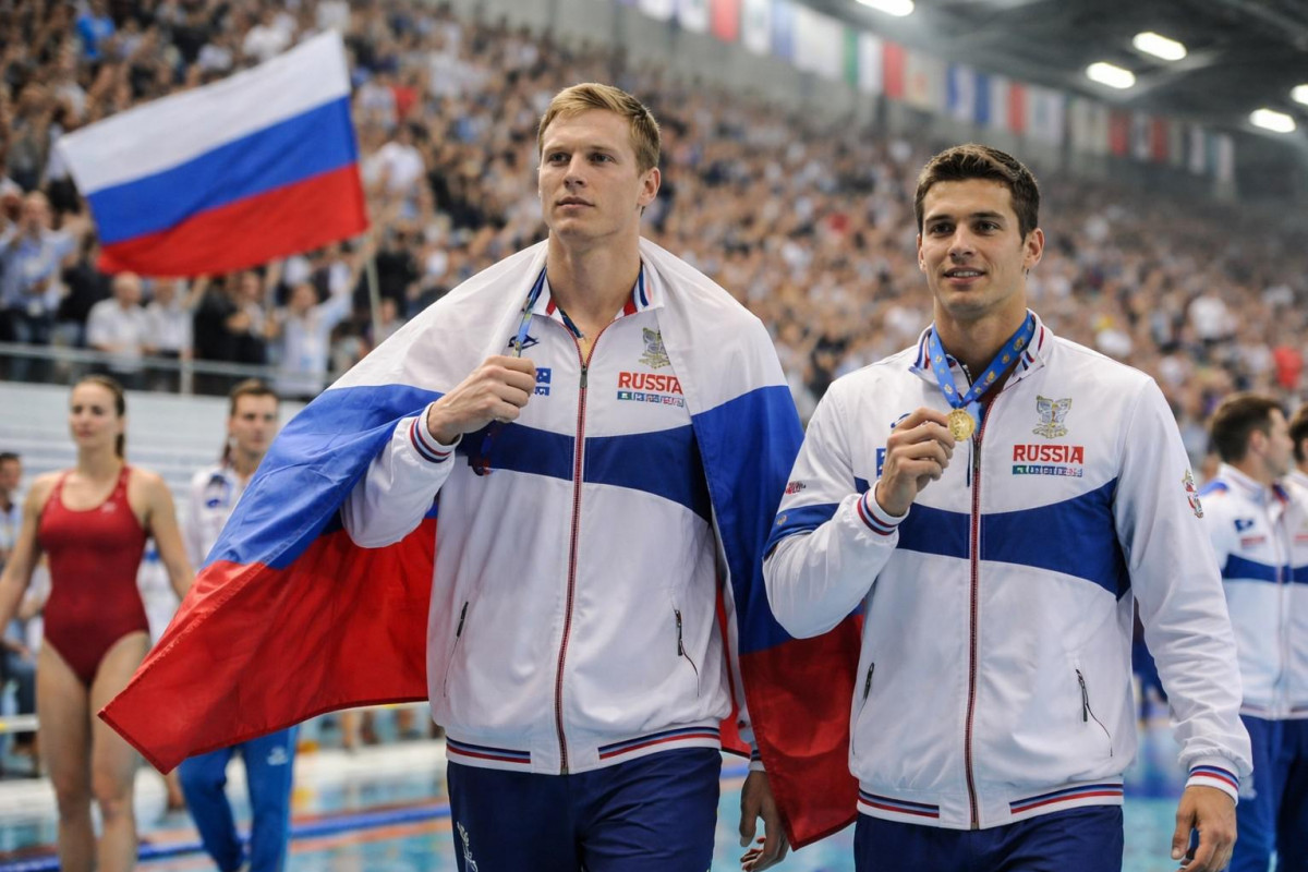 Ruští plavci zpět s vlajkou. Spor o roli politiky Ruští plavci zpět s vlajkou. Spor o roli politiky